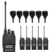 An Icom walkie-talkie set shown on a plain white background, including one large handheld unit and five smaller matching units, each with a separate microphone and each with an antenna.